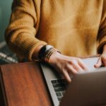 person on a laptop looking for a job