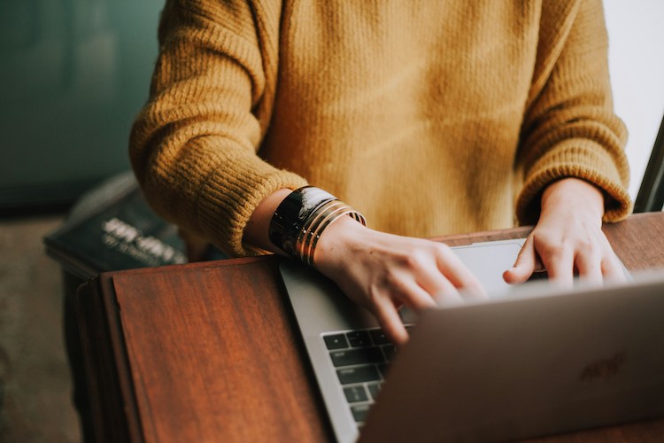 person on a laptop looking for a job
